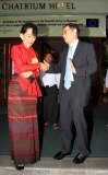 Myanmar democracy icon Aung San Suu Kyi, left, talks with Ambassador of European Union (EU) David Lipman, right,as they leave a hotel after workshop on the development in financial sector in Myanmar and its role in supporting inclusive Economic Growth and Poverty Reduction Monday, Nov.7 , 2011, in Yangon, Myanmar. The workshop is held from November 7 to November 8.