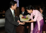 Japanese Foreign Minister Koichiro Gemba, left, is greeted by a hotel employee on his arrival to Chatrium Hotel on Sunday, Dec. 25, 2011 in Yangon, Myanmar. Gemba plans to meet with Myanmar President Thein Sein as well as opposition leader Aung San Suu Kyi on Monday