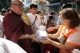 Shwe Nya War Sayadaw going around to accept the offering, 15 Feb 2012, Myanmar.