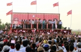 Daw Suu speaks to supporters at Dakhina Thiri township, in Naypyitaw, Monday, March.5, 2012