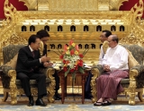 In this photo taken Monday, May 14, 2012, South Korean counterpart Lee Myung-bak, left, talks with his Myanmar counterpart Thein Sein during a meeting at the presidential house in Naypyitaw, Myanmar. (AP Photo/Yonhap, Kim Byung-man) KOREA OUT