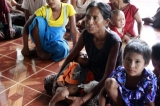 Gunshots rang out and residents fled blazing homes in western Myanmar on Tuesday as security forces struggled to contain deadly ethnic and religious violence that has killed at least a dozen people and forced thousands to flee, 12 June 2012, Rakhine State, Myanmar.