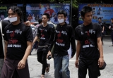 Wearing campaign T-shirt, local journalists walk to collect signs to send to the President Saturday, Aug.4, 2012, in Yangon, Myanmar. The local journalists make a campaign to ask media freedom after the recent suspension on two local journals: The Voice Weekly and Envoy by censorship board.