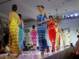 Myanmar models present weddingdress during a wedding birdal show at Park Royal hotel on Sunday, Aug.19, 2012, in Yangon, Myanmar.