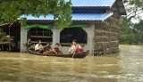 21-08-12 Delta flooding Residents take to boats after flooding in the Delta region of Burma