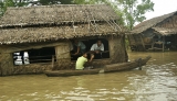21-08-12 Delta flooding Residents take to boats after flooding in the Delta region of Burma