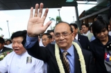 01-10-12 - Thein Sein - PHOTO - Khin Maung Win Myanmar President U Thein Sein waves his hand as  arriving at Yangon International Airport from his US tour.