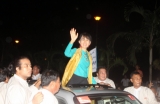 04-10-12 - Suu Kyi returns from USA - PHOTO khin Maung Win Myanmar pro-democracy leader Aung San Suu Kyi greets supporters from her vehicle on her arrival at Yangon International Airport after she came back from US Tour Thursday, Oct.4, 2012, in Yangon, Myanmar.