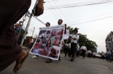 02-12-12 Mine protest - PHOTO Khin Maung Win Protesters march to protest recent violence in Monywa, in Yangon, Myanmar.