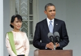 U.S. President Barack Obama, right, talks to journalists after meeting with Myanmar opposition leader Aung San Suu Kyi, left, at her lakeside residence Monday, Nov.19, 2012, in Yangon, Myanmar.(AP Photo/Khin Maung Win,Pool)