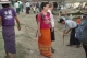 22-12-12 - PHOTO - Teza Hlaing A foreign tourist wearing traditional Burmese Longyi in Mandalay