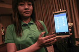 CB Bank employee explain system of  mobile banking at yangon, sedona hotel.
