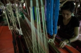 Woman make cotton weaving at Myitkyina in Kachin State. ( Photo - Thaw Hein Htet / The Irrawaddy)