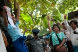 Ko Htin Kyaw, who have been charged for holding a protest, demonstrating as if he did not believe the Government at Shwe Pyi Thar Township court on 11th September and his supporters. (Photo – Sai Zaw/ Irrawaddy)