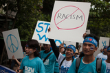 The people who wish for Peace holding signboards while marching during the marching ceremony celebrated in Yangon to honor the International Peace Day which falls on 21st September. (Photo – Sai Zaw/ Irrawaddy)