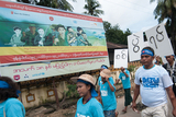 The peace-wishers holding signboards that asked to stop the war the billboard which is about 'Anti Child-soldiers' during marching ceremony celebrated in Yangon to honor the International Peace Day which falls on 21st September. (Photo – Sai Zaw/ Irrawaddy)