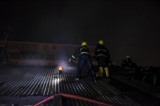 A fire broke out at a building on lower block of Maha Bandoohla Street in Kyauktada Township in downtown Rangoon on March 1 evening. The mezzanine on the top floor of the building caught fire and firefighters had to climb up to the roof of the building to put out the fire. The mezzanines of the two rooms at the top floor were damaged in the fire. (Photo: Sai Zaw/The Irrawaddy)