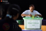 A civil servant casts a ballot at a polling station in Naypyidaw’s Zabuthiri Township during a Nov. 8 election. (Photo: J Paing / The Irrawaddy)