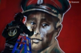 Artist Akar Kyaw spray paints a mural of General Aung San at Rangoon’s Junction Square on Feb. 13, on the date of the independence icon’s 100th birthday. (Photo: Thaw Hein Htet / The Irrawaddy)