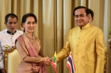 Myanmar's foreign minister and state counsellor Aung San Suu Kyi (L) shakes hands with Thailand's Prime Minister Prayuth Chan-Ocha (R)  a MOU ceremony at government house  in Bangkok, Thailand, June 24, 2016. (Photo: JPaing / The Irrawaddy)