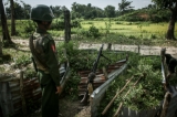 Myanmar soldier a machine gun post near the Border Guard Police headquarters in the Kyinkanpyin area of Maungdaw township, in Rakhine State on Oct17, 2016.