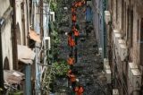 Rangoon's municipal workers cleaning the litter-strewn back alleys of downtown apartments blocks on November 11, 2016. (Photo: Hein Htet/ The Irrawaddy)