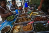 Two men eat street food for lunch in downtown Rangoon on photo: J Paing / The Irrawaddy)