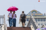 People walk around downtown under the scorching sun of summer on April 25, 2019.  Photo - Htet Wai/ Irrawaddy