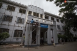 Workers performed their duties to white-wash buildings inside the Yangon University campus on July 18, 2019.  Photo - Htet Wai/ Irrawaddy