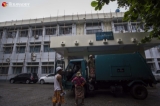 Workers performed their duties to white-wash buildings inside the Yangon University campus on July 18, 2019.  Photo - Htet Wai/ Irrawaddy