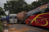 Bus and truck are stuck in heay traffic on Myawaddy-Yangon highway road on August 19, 2019.  Photo - Htet Wai/ Irrawaddy