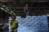 Workers unload the rice bags from the truck at Mawtin rice warehouse on March 25, 2020.  Photo - Htet Wai/ Irrawaddy  Photo - Htet Wai/ Irrawaddy