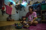 Burmese migrant worker lost her job at the sewing factory due to the Coronavirus outbreak causing no income for her to pay the daily payment and to support her child and family - Mae Sot, Tak province, Thailand, in May, 2020.